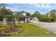Charming single-story home featuring a well-maintained lawn and neutral exterior at 2630 S Tanner Rd, Orlando, FL 32820