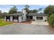 Charming single-story home featuring a well-maintained lawn and neutral exterior at 2630 S Tanner Rd, Orlando, FL 32820