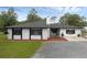 Charming single-story home featuring a well-maintained lawn and neutral exterior at 2630 S Tanner Rd, Orlando, FL 32820