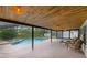 Covered patio with a pool and spillover spa create an inviting outdoor space at 2630 S Tanner Rd, Orlando, FL 32820