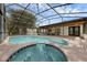 Large pool and hot tub create a resort-like backyard oasis at 2630 S Tanner Rd, Orlando, FL 32820