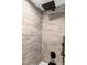 Modern shower features a rainfall shower head and matte black fixtures at 2630 S Tanner Rd, Orlando, FL 32820