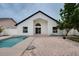 Inviting backyard with refreshing pool, brick patio, and charming architectural details, perfect for outdoor relaxation and entertainment at 2639 Monaco Cove Cir, Orlando, FL 32825