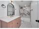 Bathroom featuring a vanity and a shower with stunning marble tile at 2639 Monaco Cove Cir, Orlando, FL 32825