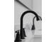 Contemporary black bathroom faucet atop a bright white marble countertop, adding a touch of modern elegance to the space at 2639 Monaco Cove Cir, Orlando, FL 32825