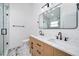 Bathroom with double vanity, marble floors and shower with glass door at 2639 Monaco Cove Cir, Orlando, FL 32825