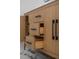 Elegant bathroom vanity showcasing light wood cabinetry, sleek black hardware, and drawers with organized storage at 2639 Monaco Cove Cir, Orlando, FL 32825