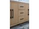 Close up of the stylish bathroom vanity with cabinets, drawers and marble floor at 2639 Monaco Cove Cir, Orlando, FL 32825