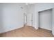 A bright, minimalist bedroom with a closet, white walls and a ceiling fan at 2639 Monaco Cove Cir, Orlando, FL 32825