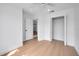 A simple bedroom with a large closet, white walls, and a ceiling fan at 2639 Monaco Cove Cir, Orlando, FL 32825