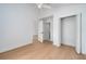 A bright, minimalist bedroom with a closet, white walls and a ceiling fan at 2639 Monaco Cove Cir, Orlando, FL 32825