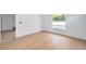 Bright bedroom with hardwood floors and a view of the pool outside the window at 2639 Monaco Cove Cir, Orlando, FL 32825