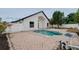 A charming backyard retreat with a refreshing pool and surrounding brick-paved patio, perfect for outdoor entertaining at 2639 Monaco Cove Cir, Orlando, FL 32825