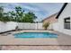 Inviting swimming pool is the perfect outdoor oasis for relaxation and recreation, enhanced by a charming white picket fence at 2639 Monaco Cove Cir, Orlando, FL 32825