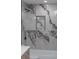 Shower with marble-style tile and black hardware at 2639 Monaco Cove Cir, Orlando, FL 32825