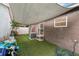 Backyard with artificial turf, playful decor and seating space at 298 San Gabriel St, Winter Springs, FL 32708