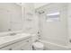 Bright bathroom featuring white vanity, toilet, shower-tub combo with shower head, and large mirror at 298 San Gabriel St, Winter Springs, FL 32708
