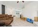 Open-concept living space with views into the kitchen at 298 San Gabriel St, Winter Springs, FL 32708