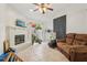 Cozy living room featuring a brick fireplace and sliding glass door leading to the outdoors at 298 San Gabriel St, Winter Springs, FL 32708