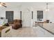 Bright living room with tile floors, and neutral paint, illuminated by natural light through the windows at 298 San Gabriel St, Winter Springs, FL 32708
