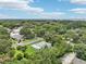 Picturesque neighborhood with tree-lined streets, providing a serene and private setting with nearby amenities and conveniences at 302 E Oakland Ave, Oakland, FL 34760