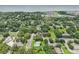 Aerial view of the property highlighting the serene, tree-lined neighborhood and community at 302 E Oakland Ave, Oakland, FL 34760