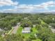 Expansive property featuring lush green spaces and mature trees, perfect for peaceful living and enjoying nature at 302 E Oakland Ave, Oakland, FL 34760