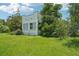 Lush, green backyard offering privacy and a tranquil setting at 302 E Oakland Ave, Oakland, FL 34760