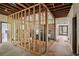 Interior room under construction with exposed studs and framing at 302 E Oakland Ave, Oakland, FL 34760
