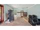 Living room with hardwood floors, large windows and light blue walls at 302 E Oakland Ave, Oakland, FL 34760