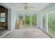 Spacious sunroom featuring natural light from the expansive windows at 302 E Oakland Ave, Oakland, FL 34760