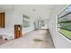 Extended sunroom with abundant natural light, perfect for relaxation at 302 E Oakland Ave, Oakland, FL 34760