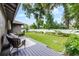 A spacious backyard with a well-manicured lawn, bordered by lush landscaping and a privacy fence at 3601 S Summerlin Ave, Orlando, FL 32806