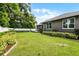 Manicured backyard with lush landscaping and a white privacy fence at 3601 S Summerlin Ave, Orlando, FL 32806