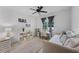 Comfortable bedroom with sofa, desk, ample natural light, and ceiling fan at 3601 S Summerlin Ave, Orlando, FL 32806