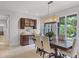 The dining room features an attractive light fixture and adjoins a small wet bar with wine fridge at 3601 S Summerlin Ave, Orlando, FL 32806
