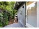 Outdoor shower with stone pavers surrounded by lush greenery and a door to the interior at 3601 S Summerlin Ave, Orlando, FL 32806