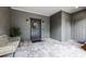 Inviting front door with elegant wreath, stylish sconces, and beautiful brick flooring at 3601 S Summerlin Ave, Orlando, FL 32806