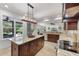 Bright kitchen featuring a central island, stainless steel appliances, and open layout to the living area at 3601 S Summerlin Ave, Orlando, FL 32806