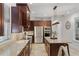 Beautiful kitchen with stainless steel appliances, granite counters, and an island with pendant lighting at 3601 S Summerlin Ave, Orlando, FL 32806