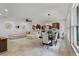 The living room features tile floors, a comfortable sectional, and seamlessly adjoins the kitchen at 3601 S Summerlin Ave, Orlando, FL 32806