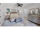 Relaxing main bedroom with a large bed, neutral tones, and access to an en-suite bathroom at 3601 S Summerlin Ave, Orlando, FL 32806