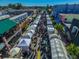 Aerial view of a bustling street fair with vendors and shoppers, offering a vibrant community atmosphere at 410 Winter Bliss Ln, Mount Dora, FL 32757