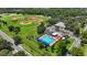 Aerial view of a community park featuring baseball fields and a swimming pool at 410 Winter Bliss Ln, Mount Dora, FL 32757