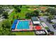 Aerial view showcasing a community pool, baseball fields, and recreational facilities at 410 Winter Bliss Ln, Mount Dora, FL 32757