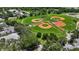Beautiful baseball field with lush green grass and red clay, perfect for recreation and sports at 410 Winter Bliss Ln, Mount Dora, FL 32757