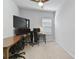 Spacious bedroom featuring a ceiling fan and two large desks, perfect for working from home at 410 Winter Bliss Ln, Mount Dora, FL 32757