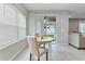 Breakfast nook featuring tile floors and a sliding glass door that leads to the backyard at 410 Winter Bliss Ln, Mount Dora, FL 32757