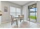 Bright breakfast nook featuring a sliding glass door that leads to the backyard at 410 Winter Bliss Ln, Mount Dora, FL 32757