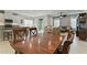 Open concept layout featuring a dining area with backyard access and a glimpse of the living room at 410 Winter Bliss Ln, Mount Dora, FL 32757